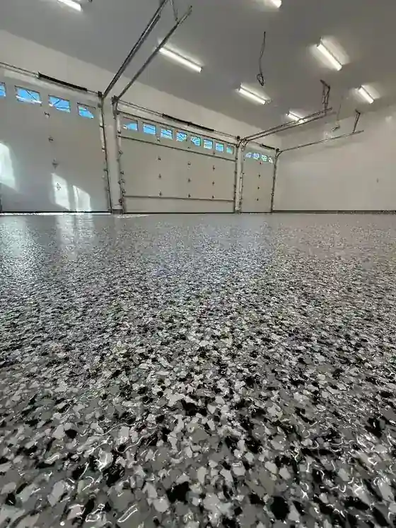 Premium flake epoxy garage floor in a clean organized garage